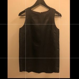 Sleeveless embossed dress.